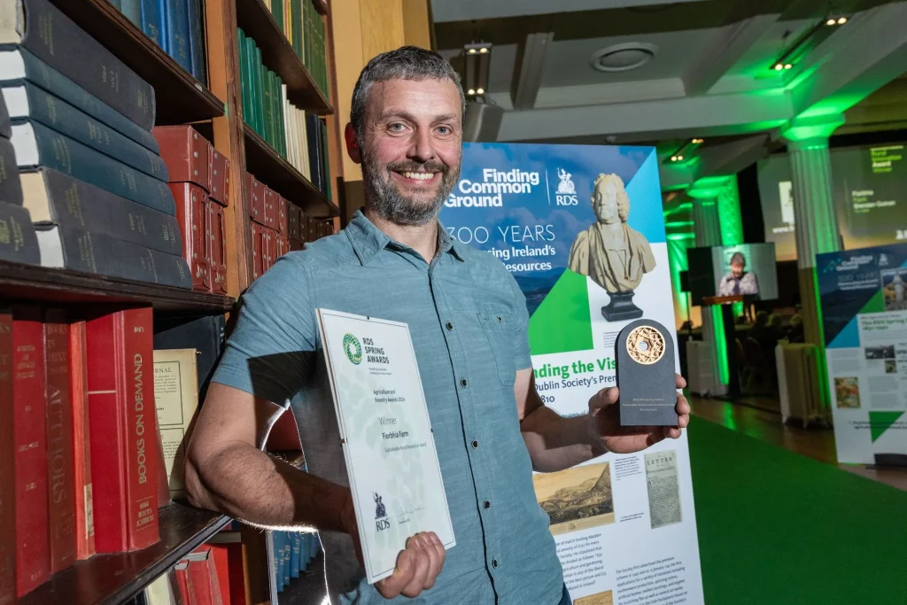 Brendan holding award at RDS Sustainable Rural Innovation Awards