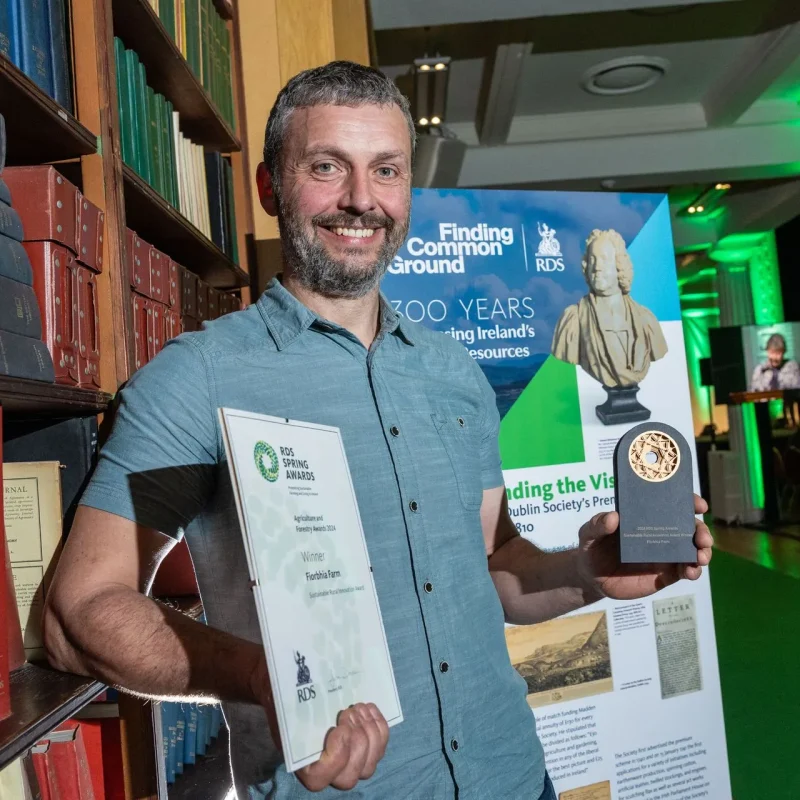 Brendan holding award at RDS Sustainable Rural Innovation Awards